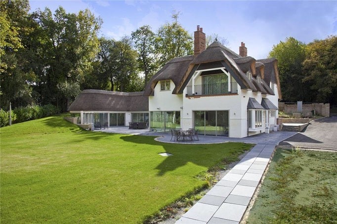 A new build with a thatched roof in Sevenoaks, built by DPT Contractors